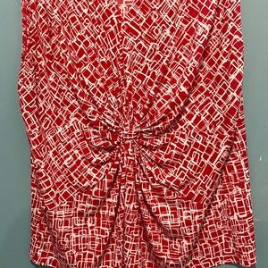 Sleeveless blouse with figure flattering front detail